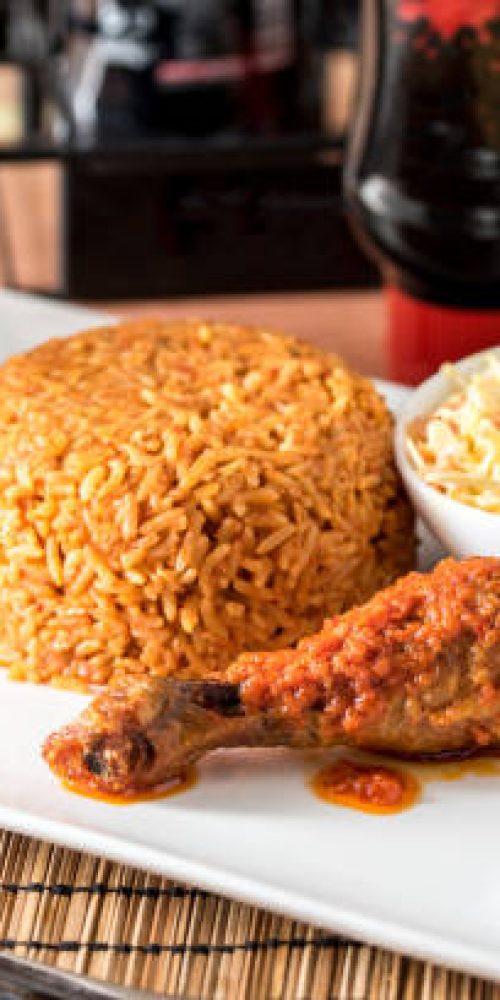 Regional African Food on white plate on wooden background