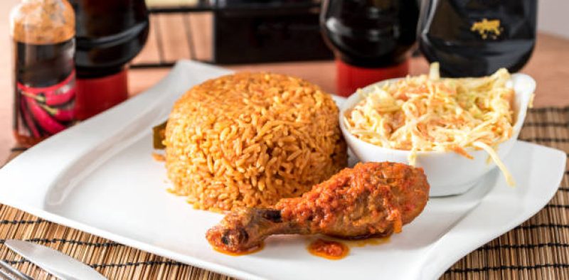 Regional African Food on white plate on wooden background