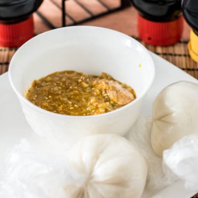 Regional African Food on white plate on wooden background