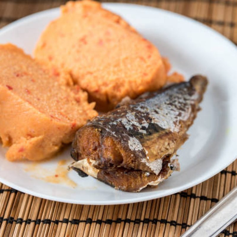 Regional African Food on white plate on wooden background